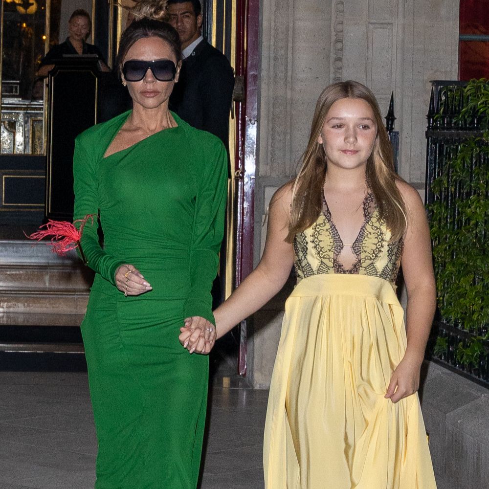 Harper Beckham is a fashionista as she poses with mum Victoria's vintage Louis  Vuitton pochette